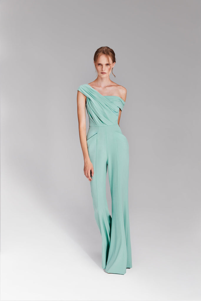 crepe jumpsuit with a playful bust draping & asymmetrical off the shoulder